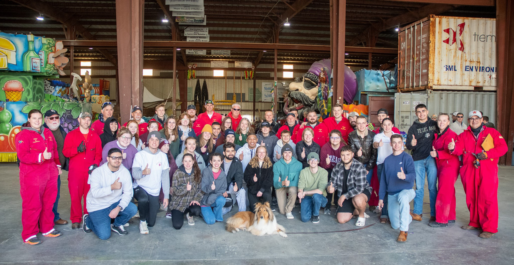 Students and volunteers at a Mardi Gras float den