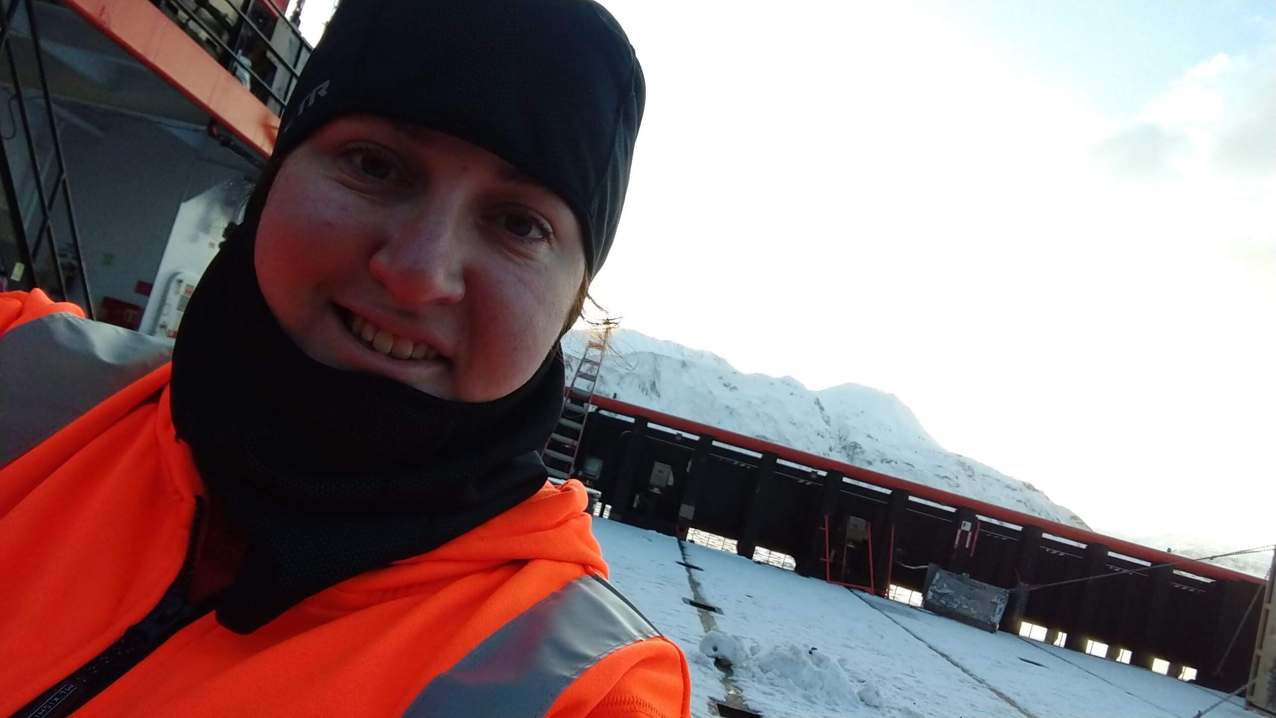 Female mariner working on boat in Alaska.