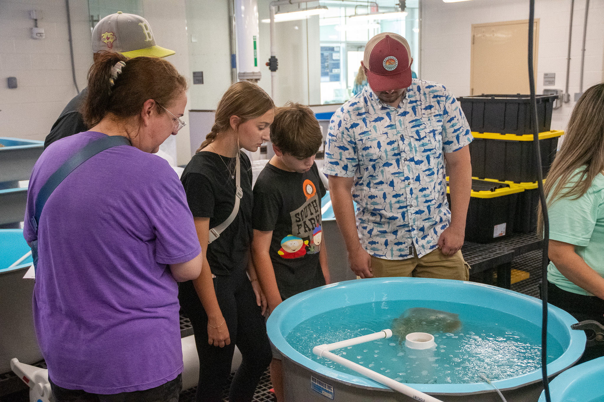 Visitors to Aggieland Saturday by the Sea in the Sea Life Facility