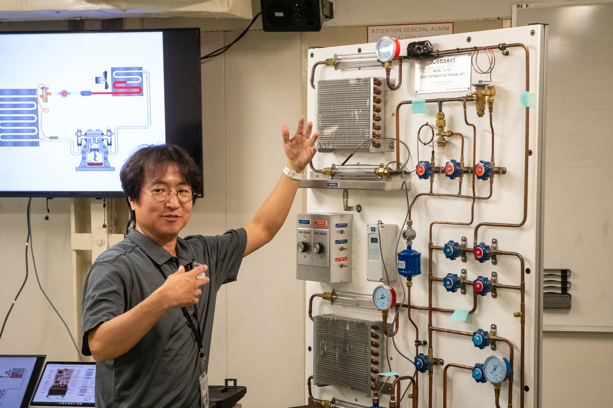 Dr. Jiwoong Lee demonstrating a refrigeration training unit at Aggieland Saturday by the Sea