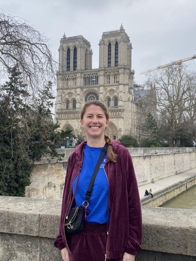 Donnelly in foreground with Notre Dame Cathedral in Paris, France in background