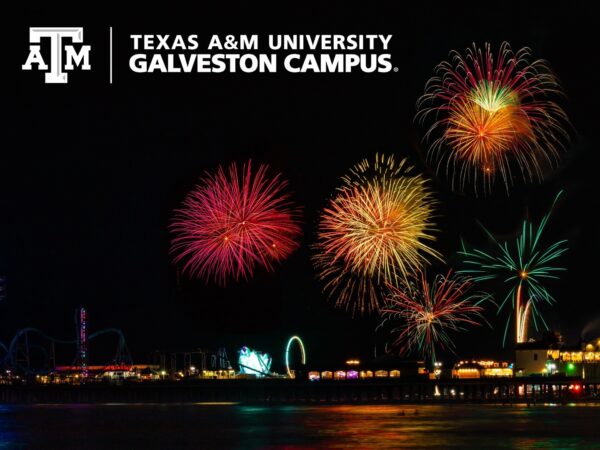 Colorful fireworks over Galveston's Pleasure Pier with the Texas A&M University Galveston Campus mark in the top left hand corner